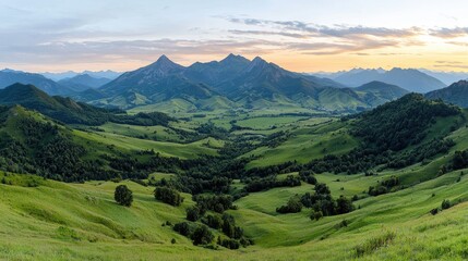 Obraz premium Majestic sunset over rolling green hills and mountains