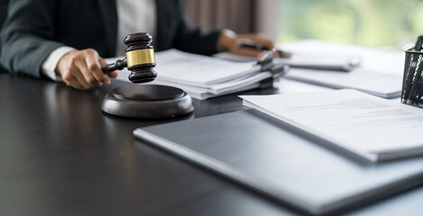 Lawyer businessman working with lawbook in office or courtroom Legal counsel with gavel and legal law. justice and lawyer concept Judge gavel hammer on Lawyer desk