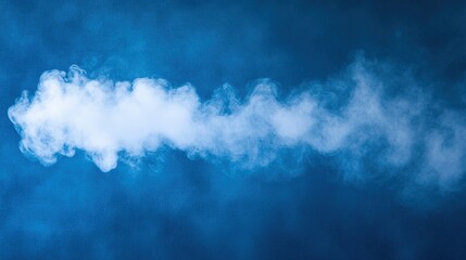 Obraz premium Isolated Water Droplets and Spray Steam in Foggy Air on Blue Background. Aesthetic and Ethereal Liquid Elements in a Clean and Fresh Visual Composition