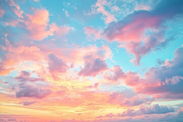 Obraz premium Beautiful sunset sky with pastel colors of pink, orange, yellow, white, and purple, creating a dreamy atmosphere and endless blue horizon.