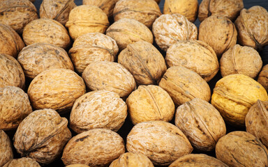 Closeup of ripe walnuts on a black background