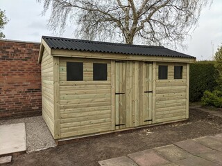 Newly built wood shed or workshop in garden