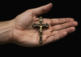 still life of crucifix held in hand
