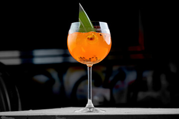 A classic Aperol Spritz made with Aperol, prosecco, and soda water, garnished with an orange slice