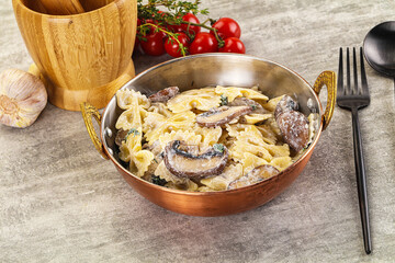 Italian cuisine - farfalle with mushrooms