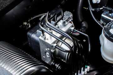 Close up of ABS module in engine bay , Anti lock brake system module of car brake system , automotive parts concept