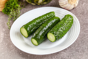 Homemade lighty salted cucumbers with herbs
