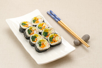 Korean Rolled Gimbap, made of rice, cucumber, tuna, carrot, sausage, crab stick and wrapped with seaweed laver. 
