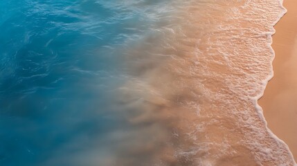 Fototapeta premium Serene beach scene with gentle waves lapping at the sandy shore during sunset, evoking tranquility