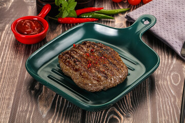 Grilled beef burger cutlet with sauce