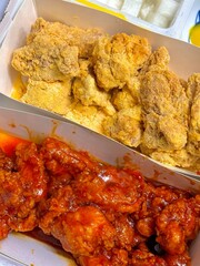 Crispy Korean fried chicken, perfectly glazed with a sweet and spicy sauce. Ideal for food photography and menus, showcasing the irresistible crunch and flavor of this beloved dish.
