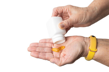 Senior female hand pouring yellow omega-3 capsules from a plastic bottle into a palm, fatty acids, fish oil supplements, isolated on a transparent background