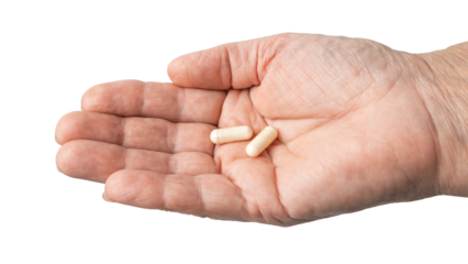Senior female hand holding white medicine capsules in a palm, antibiotic pills, vitamins, or painkillers, isolated on a transparent background. Healthcare and treatment concept