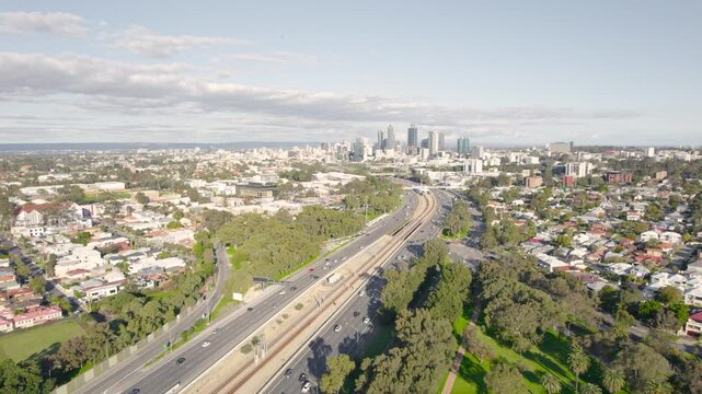 Cars Driving Along The Yanchep Line In Suburban Perth City, Western Australia. - aerial shot