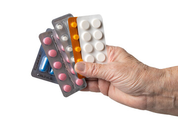 Senior female hand holding various blister packs of prescription medication, antibiotic pills,...