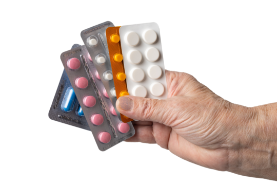 Senior female hand holding various blister packs of prescription medication, antibiotic pills, painkiller capsules, isolated on a transparent background. Healthcare, elderly care, medical treatment 