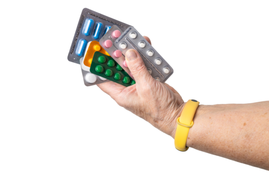 Senior female hand holding various blister packs of prescription medication, antibiotic pills, painkiller capsules, isolated on a transparent background. Healthcare, elderly care, medical treatment