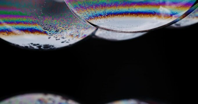 Psychedelic soap bubbles showing wild colors before bursting