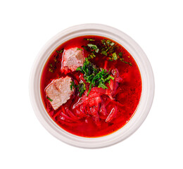 Rich beetroot soup served in a bowl with tender meat and fresh herbs, highlighting a traditional dish enjoyed worldwide
