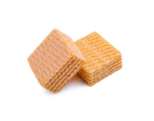 Delicious golden wafers stacked on a white background showcasing their texture and flavor