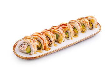 Sushi rolls arranged neatly on a white platter with drizzled sauce for a gourmet presentation
