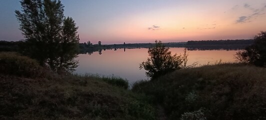 Obraz premium sunset over the river