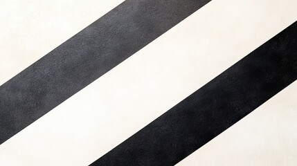 Abstract diagonal black and white striped pattern on a textured surface, suitable for backgrounds