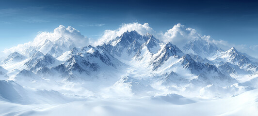 Fototapeta premium Expansive view of snow covered mountain range under clear blue sky, evoking serenity