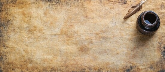 Vintage inkwell and quill pen on aged paper with parchment in background creating artistic atmosphere ideal for text overlay and elegant designs
