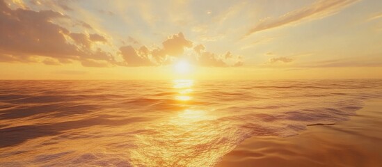 Stunning golden sunrise reflecting on tranquil sea waters creating a serene and picturesque seascape scene.