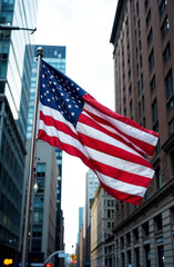 US flag in downtown against the backdrop of buildings in America.