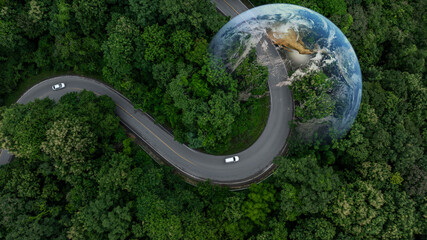 Aerial view EV electric vehicle car on middle green tree forest road globe earth planet, EV car electric vehicle car alternative sustainable energy eco power, Green business ecosystem environment.