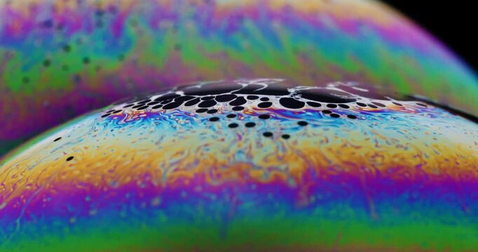 Psychedelic colors and vapor like structures waving across surface of complex fluid dynamics on soap bubble