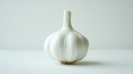 A whole garlic bulb isolated on a clean white background, highlighting its texture and natural shape, perfect for culinary or health-focused product photography.