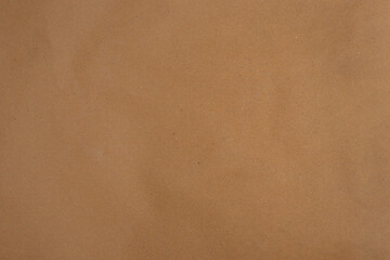 Old brown wrapping paper textured background.