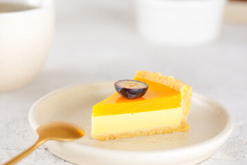 Piece of homemade mango tart with fresh blueberry in a plate. Sugar, sugar substitutes, lactose and gluten free. Vegan dessert.