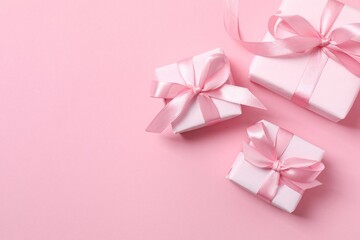 Beautiful gift boxes on pink background