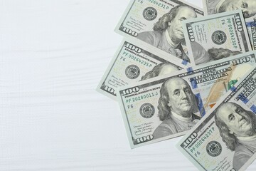 Money, hundred dollar background pattern on wooden background. Money is scattered on the table. Finance and economics. Saving money concept. Saving currency. Investments. Copy space