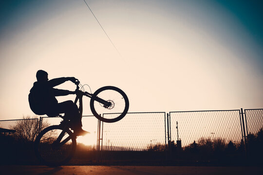 Boy on a bicycle at dusk