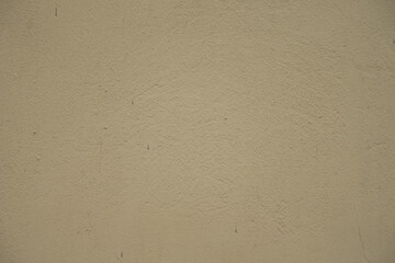 Close view of old and dirty beige painted wall