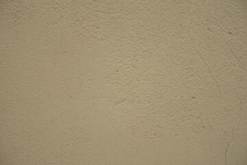 Closeup of old and dirty beige painted wall
