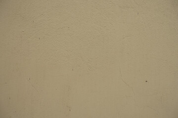 Dusty surface of old beige painted wall