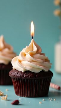Chocolate cupcake with buttercream frosting, lit candle, tasty, holiday