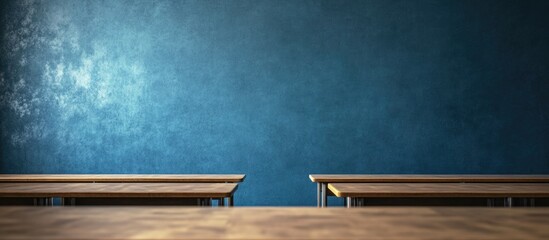 Dark Empty Classroom Featuring Wooden Desks Against a Blue Wall Ideal for Text Placement and Educational Themes
