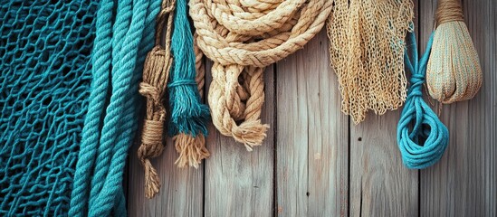 Professional fishing nets and ropes displayed on wooden surface showcasing texture and colors of nautical equipment for marine activities