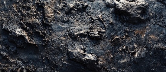 Dark textured concrete surface for industrial background or abstract design elements.