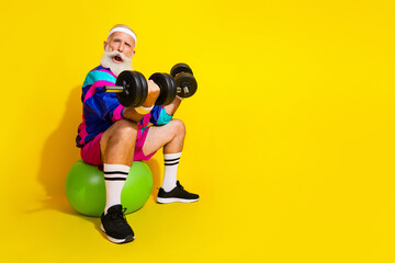 Full length photo banner of sportive cheerful old man lifting weights fitball dressed retro...