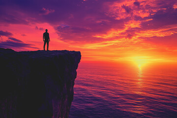 Fototapeta premium Man standing on a cliff overlooking the ocean with blue sky and waves crashing below in a scenic natural landscape