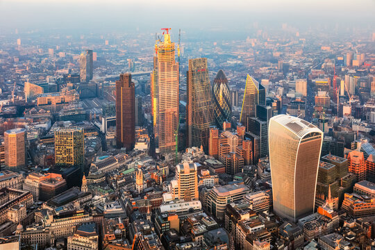 Aerial view of London financial district skyline at sunset, UK