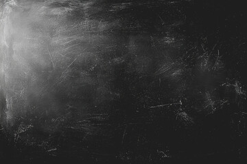 Black and white photograph featuring a dark background with subtle textures and tones creating a moody atmosphere for artistic or creative purposes